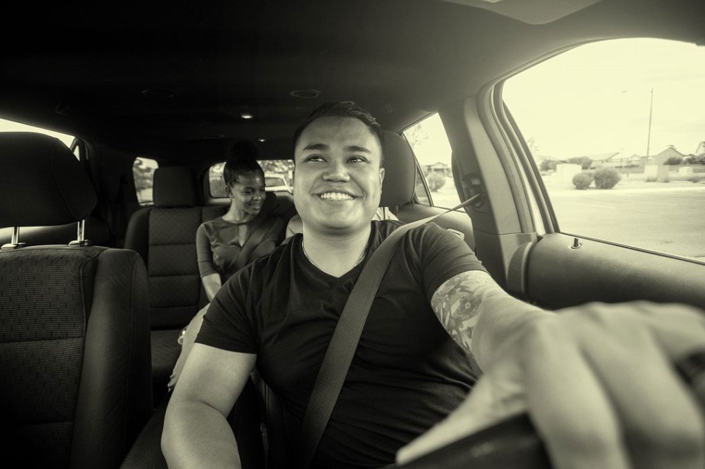 A group of young people using a ride sharing service.